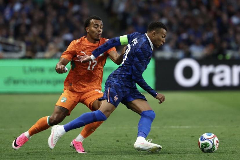 Ivory Coast's defender #17 Guela Doue (L) fights for the ball with France's forward #10 Kylian Mbappe during the international friendly football match between France and Ivory Coast ahead of the 2026 FIFA World Cup football tournament at the Stade de la Beaujoire in Nantes, western France, on June 4, 2026.  FRANCK FIFE / AFP
