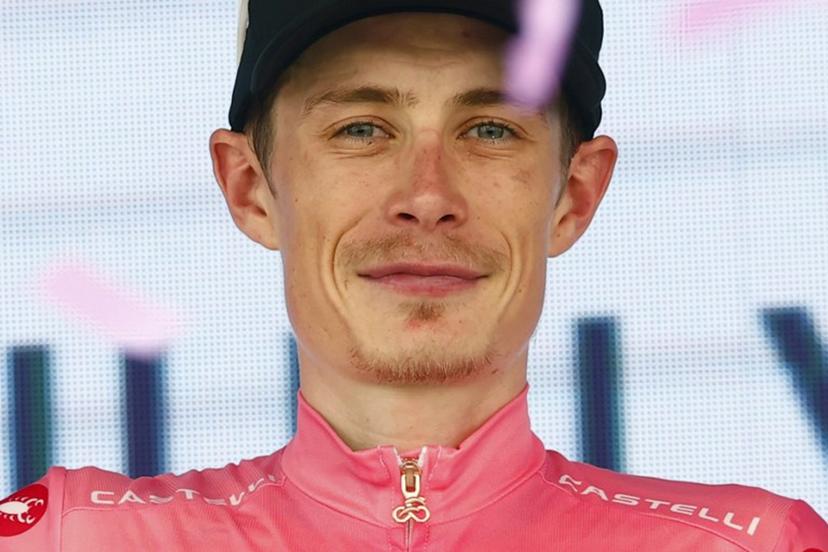 Team Visma Lease a Bike Danish rider Jonas Vingegaard celebrates the overall leader's pink jersey on the podium of the 15th stage of the Giro d'Italia 2026 - Tour of Italy cycling race between Voghera and Milan, Italy, on May 24, 2026.  Luca Bettini / AFP