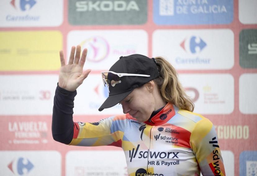 Stage winner and overall leader Team SD Worx - Protime's Dutch rider Anna van der Breggen celebrates on the podium of the 6th stage of the 2026 La Vuelta Femenina cycling tour of Spain, a 106.5 km race between Gijon and Les Praeres, on May 8, 2026.   Miguel RIOPA / AFP