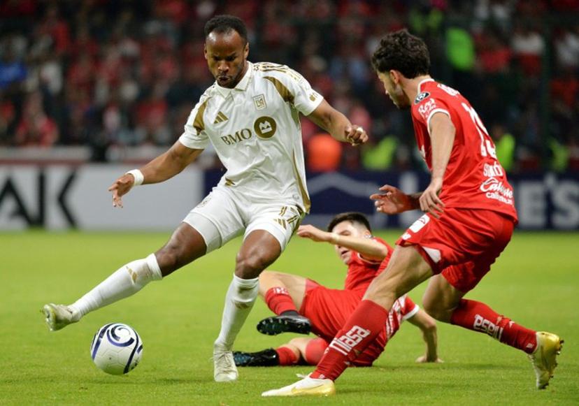 Los Angeles FC's French forward #17 Jeremy Ebobisse and Toluca's Argentine midfielder #19 Santiago Simon fight for the ball during the CONCACAF Champions Cup semifinal second leg football match between Mexico's Toluca and US' Los AngelesFC (LAFC) at the Nemesio Diaz stadium in Toluca, sate of Mexixo, Mexico on May 6, 2026.  Mario Vazquez / AFP