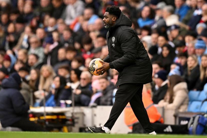 Manchester City's Ivorian assistant coach Kolo Touré holds the ball during the English FA Cup third round football match between Manchester City and Salford City at the Etihad Stadium in Manchester, north west England, on February 14, 2026.  Oli SCARFF / AFP