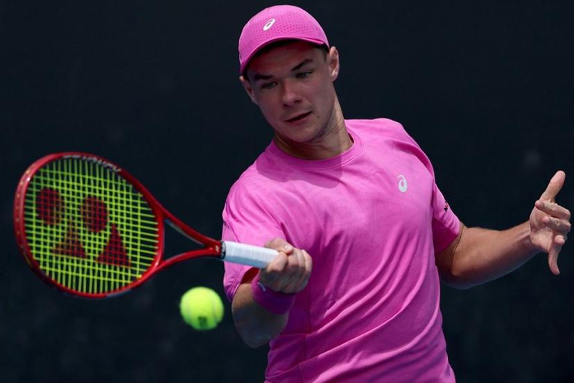 Poland's Kamil Majchrzak hits a return to Hungary's Fabian Marozsan during their men's singles match on day four of the Australian Open tennis tournament in Melbourne on January 21, 2026.  Martin KEEP / AFP