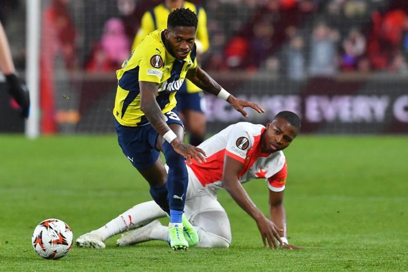 Slavia Prague's Cameroon forward #14 Simion Michez (R) fights for the ball with Fenerbahce's Brazilian midfielder #13 Fred during the UEFA Europa League football match between Slavia Prague and Fenerbahce SK in Prague, Czech Republic on November 28, 2024.  Michal Cizek / AFP