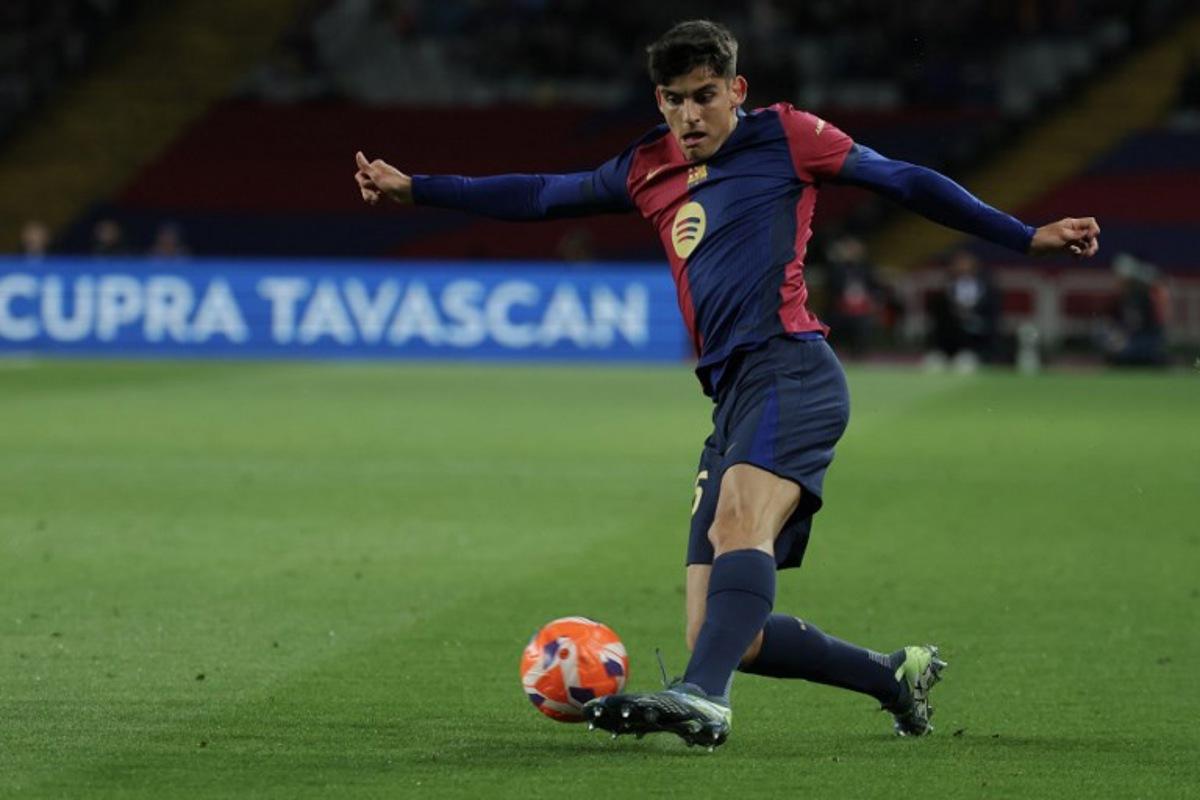 Barcelona's Spanish defender #35 Gerard Martin kicks the ball during the Spanish league football match between FC Barcelona and RCD Mallorca at the Estadi Olimpic Lluis Companys in Barcelona, on April 22, 2025.  LLUIS GENE / AFP