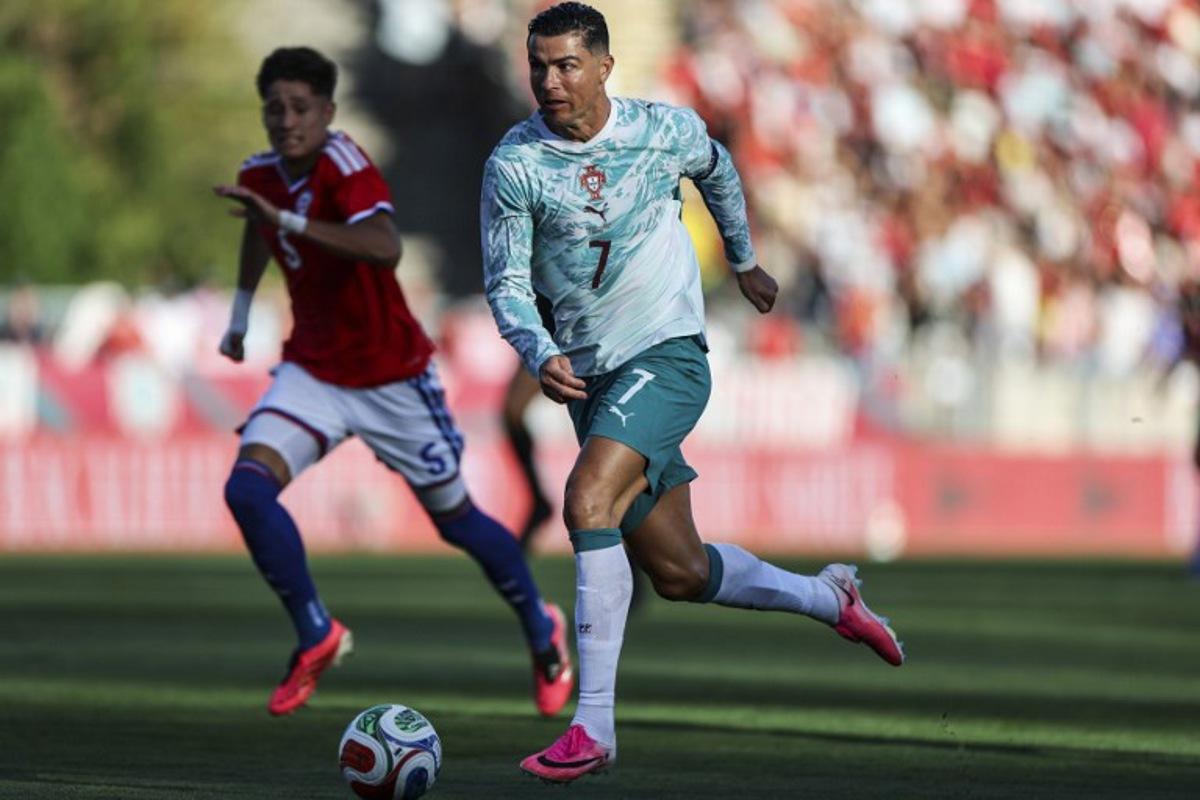 Portugal's forward #07 Cristiano Ronaldo dribbles the ball during the international friendly football match between Portugal and Chile at Estadio Nacional do Jamor in Oeiras, on June 6, 2026.  PATRICIA DE MELO MOREIRA / AFP