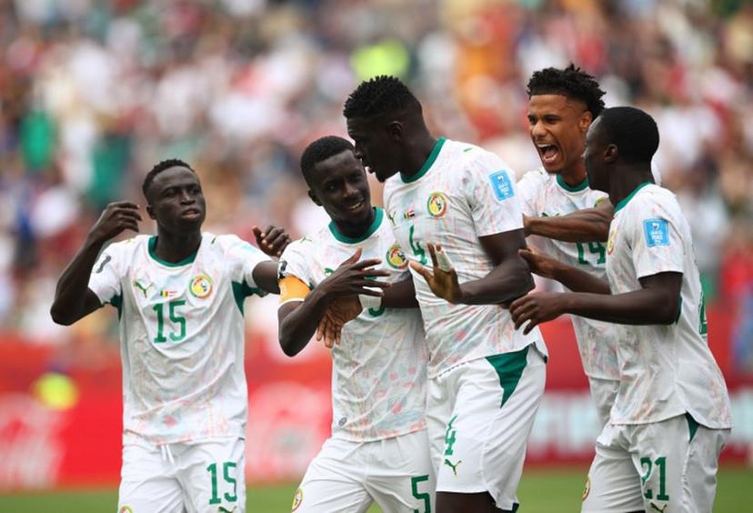 Senegal's defender #04 Abdoulaye Seck celebrates with teammates after scoring his team's first goal during the 2026 World Cup Group I football match between Senegal and Iraq at the Toronto Stadium in Toronto on June 26, 2026.   Cole Burston / AFP