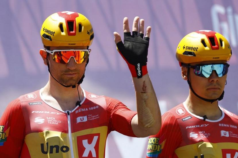 Uno X Mobility Norwegian rider Erlend Blikra (L) waves during the presentation prior the 4th stage of the Giro d'Italia 2026 - Tour of Italy cycling race between Catanzaro and Cosenza, Italy, on May 12, 2026.  Luca Bettini / AFP