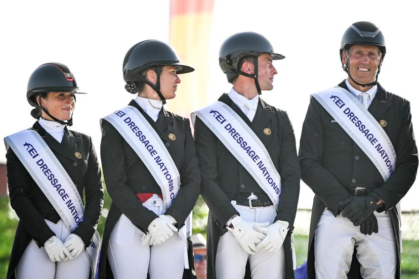 Belgian Charlotte Defalque, Belgian Larissa Pauluis, Belgian Justin Verboomen and Belgian Wim Verwimp pictured during the podium ceremony after the Dressage Nations Cup FEI CDIO4 equestrian event in Koningshooikt, Lier on Saturday 23 May 2026. BELGA PHOTO ELIAS ROM