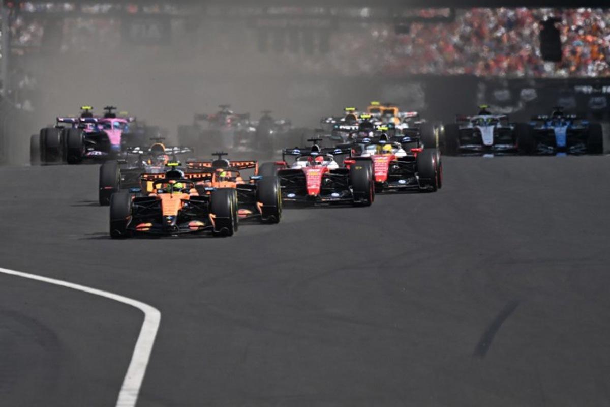 McLaren's British driver Lando Norris (C) followed by McLaren's Australian driver Oscar Piastri (C-R) and other cars compete during the Formula One Hungarian Grand Prix at the Hungaroring racetrack in Mogyorod near Budapest, Hungary, on July 26, 2026.  Attila KISBENEDEK / AFP