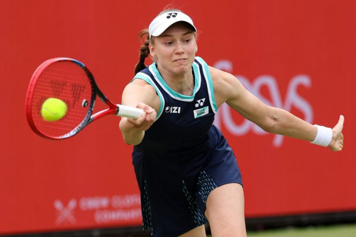 Kazakhstan's Elena Rybakina returns the ball during her round of 16 women's singles match against Germany's Tatjana Maria at the HSBC WTA tennis Championships at Queen's Club in west London on June 12, 2026.  Adrian Dennis / AFP