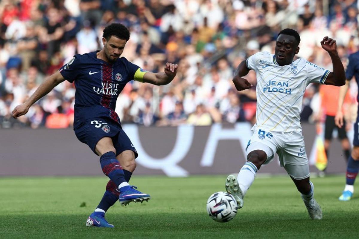 Paris Saint-Germain's French midfielder #33 Warren Zaïre-Emery (L) scores his side's second goal during the French L1 football match between Paris Saint-Germain (PSG) and FC Lorient at Parc des Princes stadium in Paris on May 2, 2026.  FRANCK FIFE / AFP
