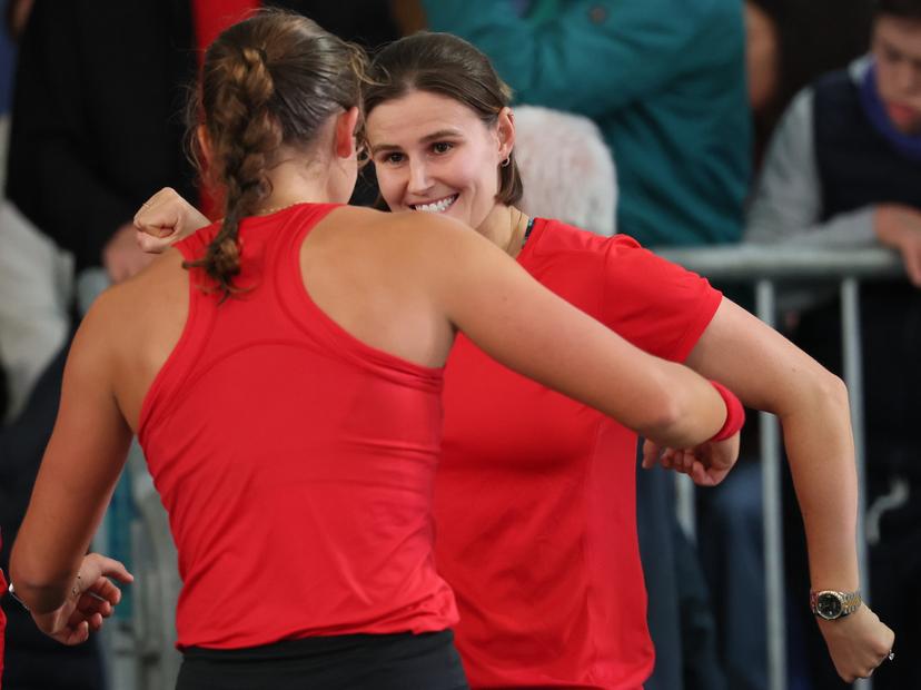 Belgian Hanne Vandewinkel and Belgian Greet Minnen celebrate after the second game between Belgian Vandewinkel and Turkish Sonmez in the Billie Jean King Cup Play-offs, between Belgium and Turkey, on Saturday 15 November 2025 in Ismaning, Germany. PHOTO BENOIT DOPPAGNE