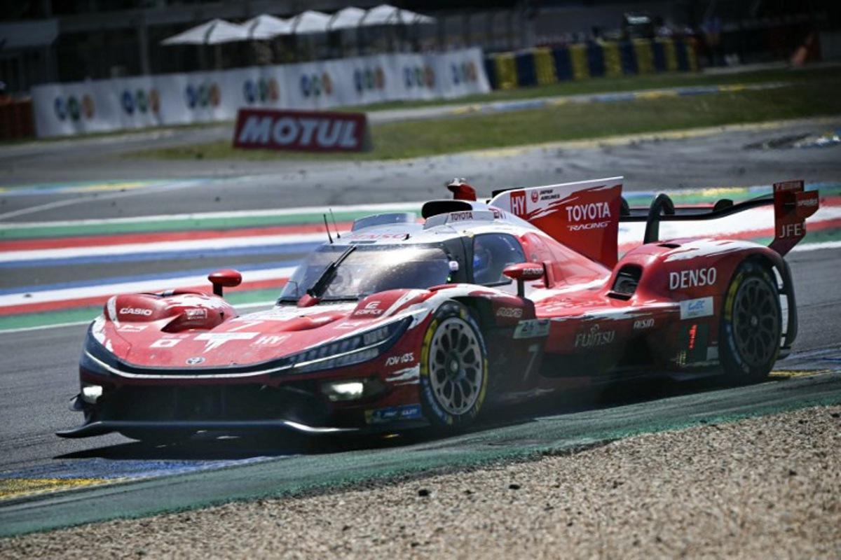 The Toyota Racing's car of British driver Mike Conway, Japanese driver Kamui Kobayashi and Dutch driver Nyck de Vriestakes a corner during the 94th edition of the 24 Hours of Le Mans at the Le Mans circuit, north-western France, on June 14, 2026.  Lou BENOIST / AFP