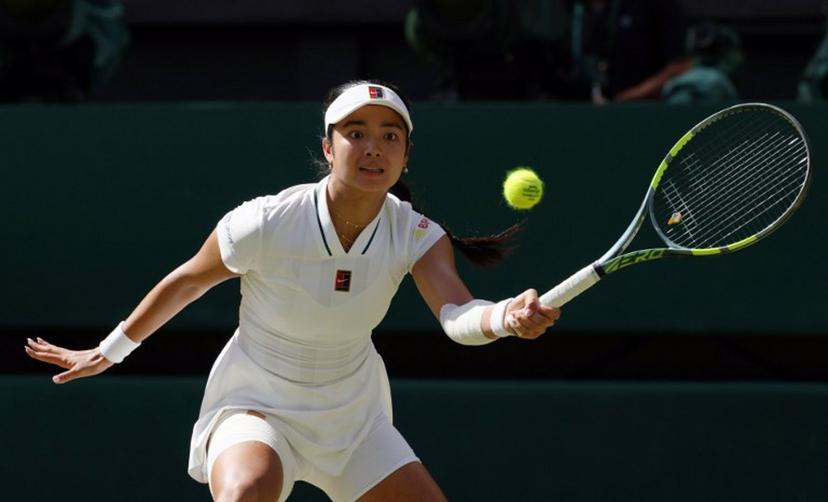 Philippines' Alexandra Eala returns to Italy's Jasmine Paolini during their women's singles round of 16 tennis match on the eighth day of the 2026 Wimbledon Championships at The All England Lawn Tennis and Croquet Club in Wimbledon, southwest London, on July 6, 2026.  Adrian Dennis / AFP