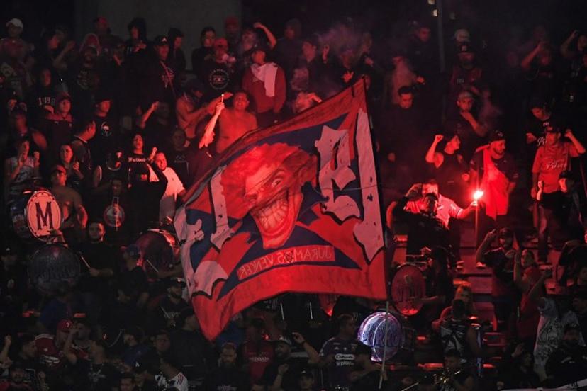 Medellin fans set off flares during the Copa Libertadores group stage football match between Colombia's Independiente Medellin and Brazil's Flamengo at the Atanasio Girardot stadium in Medellin, Antioquia department, Colombia on May 7, 2026. The match between Colombia's Independiente Medellin and Flamengo, the reigning Copa Libertadores champions, was cancelled following incidents triggered by protests from the home team's fans in the stands, Conmebol said on May 7. Jaime SALDARRIAGA / AFP