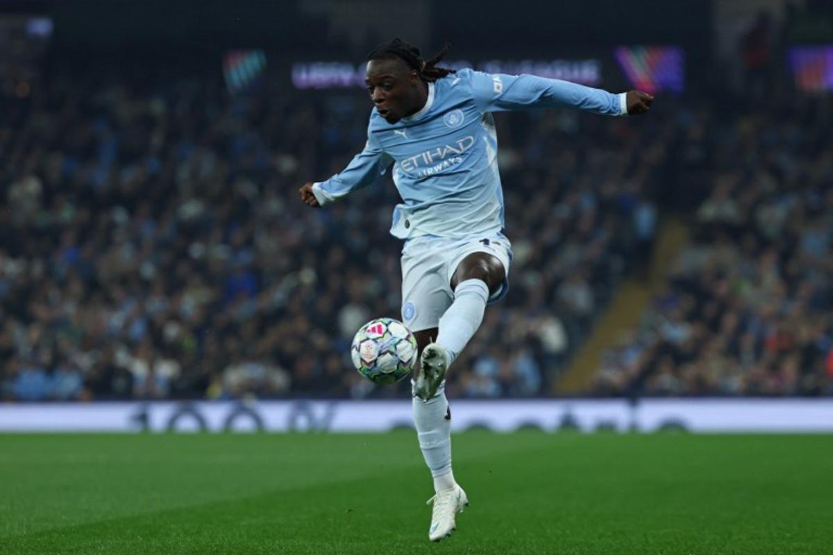 Manchester City's Belgian midfielder #11 Jeremy Doku controls the ball during the UEFA Champions League, league phase football match between Manchester City and Paris Saint Germain at the Etihad Stadium in Manchester, north west England, on October 14, 2026.  FRANCK FIFE / AFP