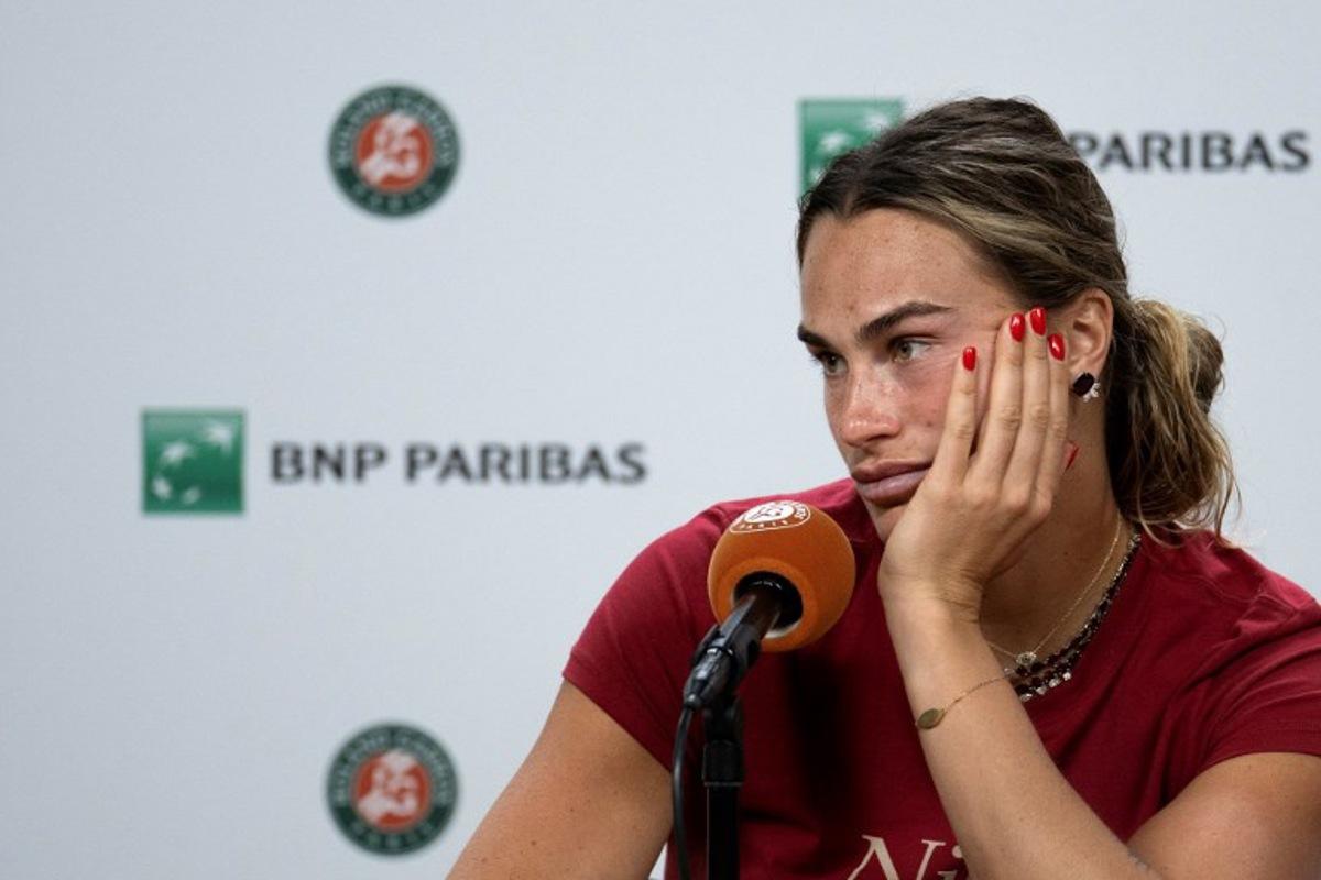 Aryna Sabalenka reacts during a press conference after being defeated by Diana Shnaider during their women's quarter final singles match on day 11 of the French Open tennis tournament on Court Philippe-Chatrier at the Roland-Garros Complex in Paris on June 3, 2026.  Sébastien DUPUY / AFP