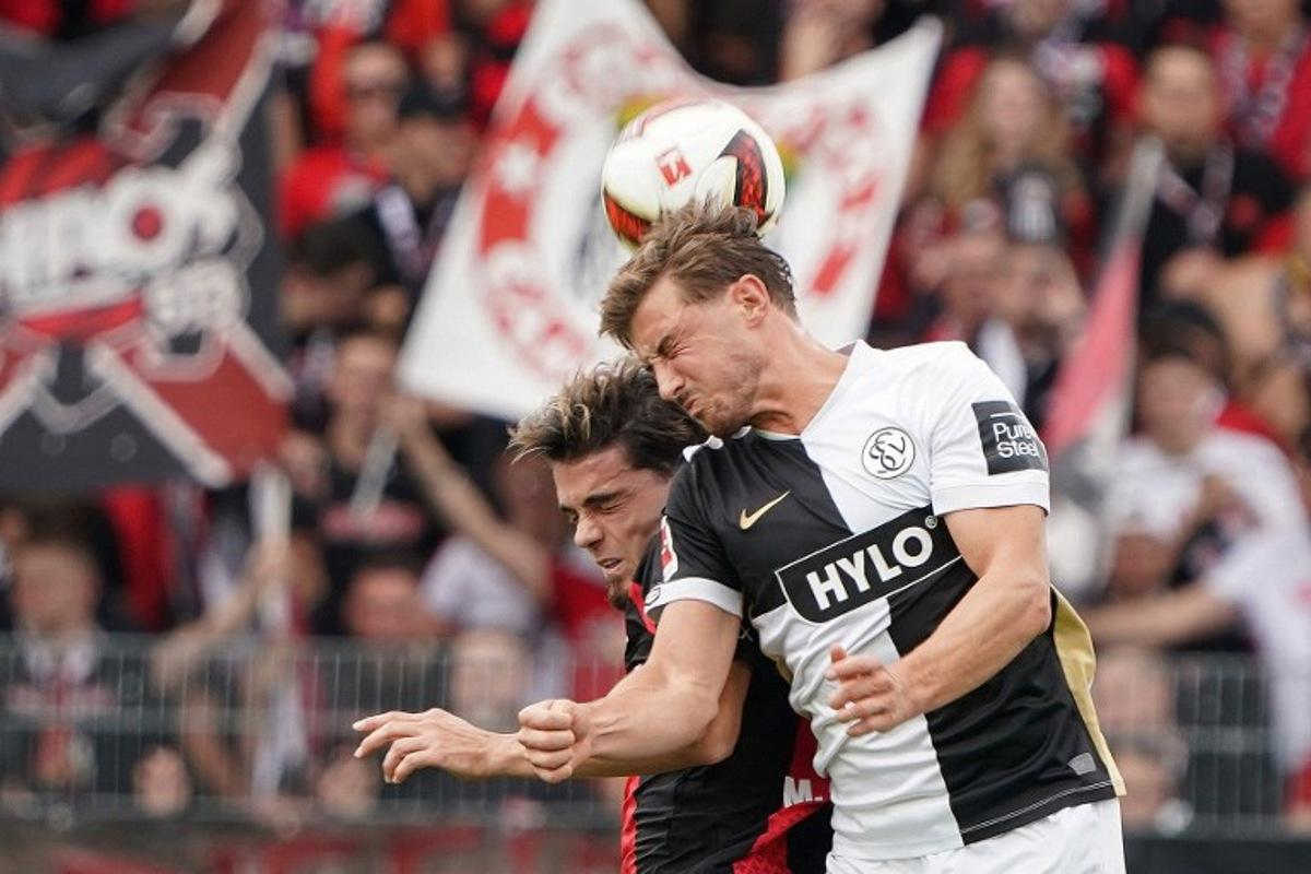 SV Elversberg's Bulgarian forward #25 Lukas Petkov and Bayer Leverkusen's Spanish defender #03 Miguel Gutierrez vie for the ball during the German first division Bundesliga football match between SV Elversberg and Bayer 04 Leverkusen at the Ursapharm Arena in Spiesen-Elversberg, southern Germany on August 29, 2026.  Andreas Schlichter / AFP