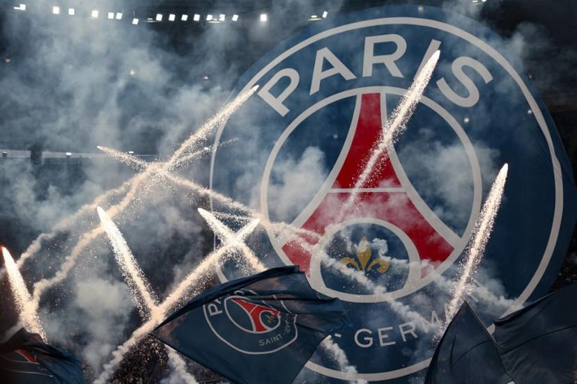 Flags and banners with the PSG logo are waved as fireworks are set off during a show prior to the French Cup final football match between Paris Saint-Germain (PSG) and Stade de Reims at the Stade de France in Saint-Denis, north of Paris, on May 24, 2025.   FRANCK FIFE / AFP