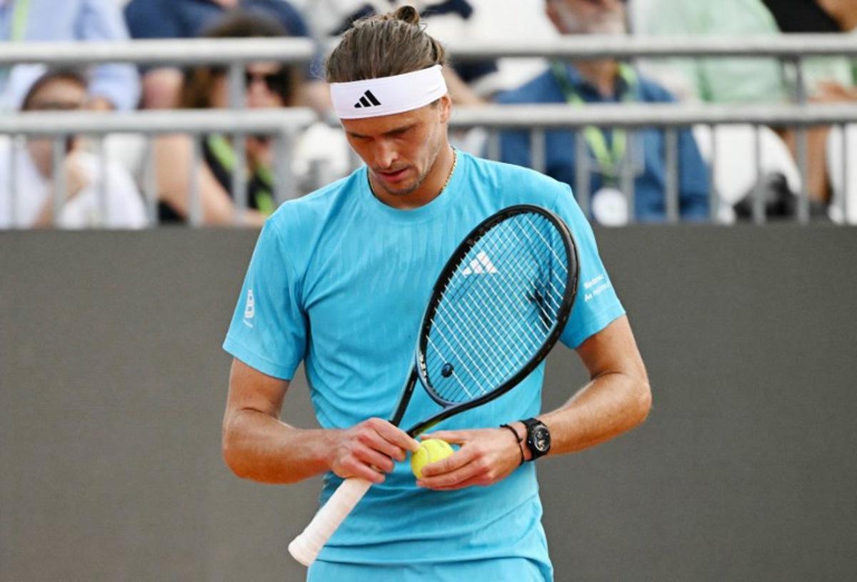 Germany's Alexander Zverev reacts during the match against Italy's Luciano Darderi during the ATP Rome Open tennis tournament at Foro Italico in Rome on May 12, 2026.   Andreas SOLARO / AFP