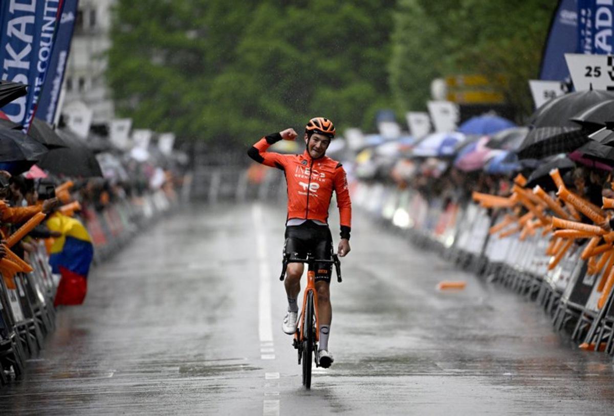 Team Ineos' US rider AJ August celebrates winning the sixth and last stage of the Basque Country's Itzulia cycling tour, a 135.4 km race between Goizper-Antzuola and Bergara, on April 11, 2026.   ANDER GILLENEA / AFP