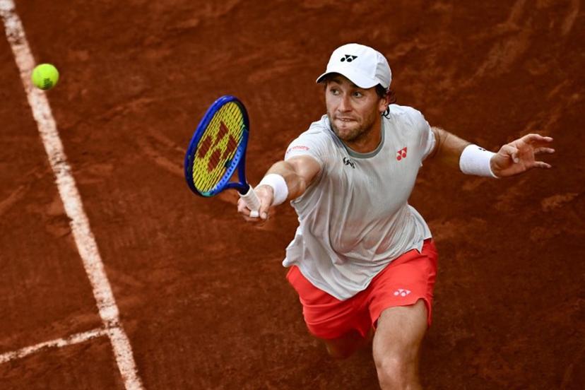 Norway's Casper Ruud plays a backhand return to US Tommy Paul during their men's singles match on day 6 of the French Open tennis tournament on Court Suzanne-Lenglen at the Roland-Garros Complex in Paris on May 29, 2026.  JULIEN DE ROSA / AFP