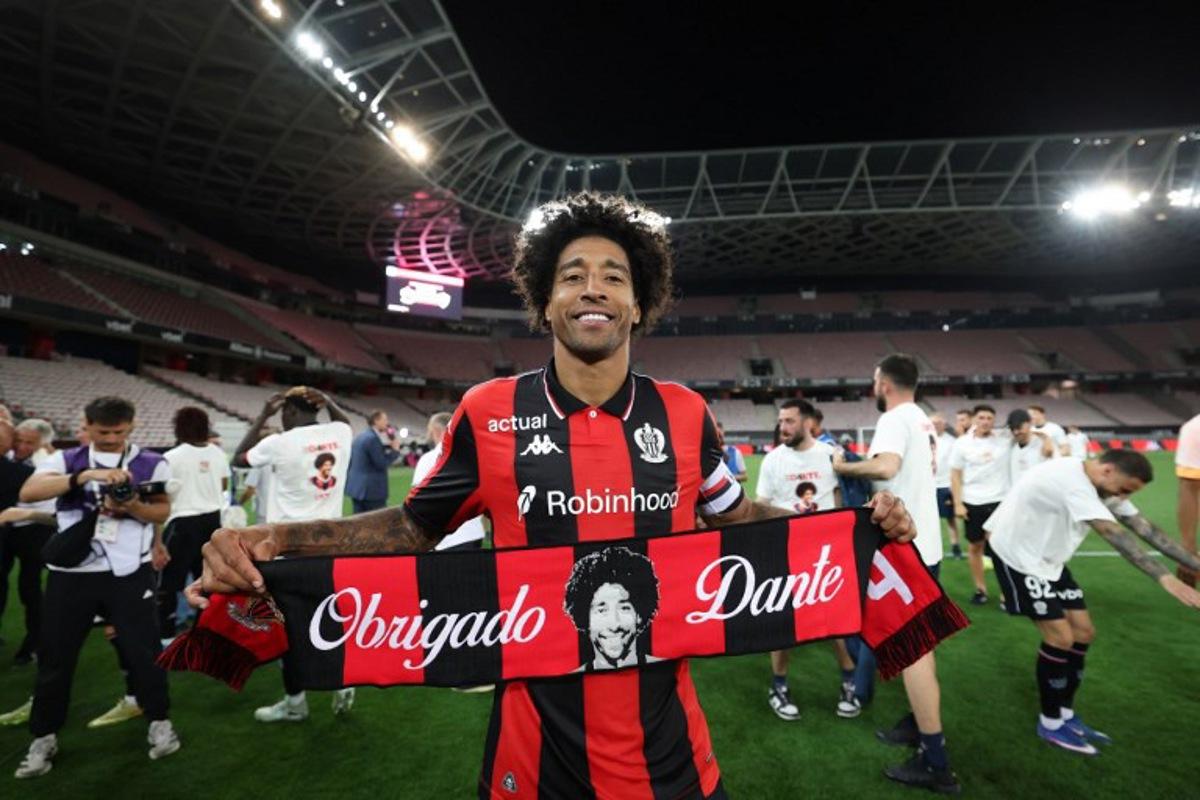Nice's Brazilian defender #04 Dante celebrates after winning the L1-L2 playoff second-leg football match between first divison club OGC Nice and second division club AS Saint-Etienne at the Allianz Riviera Stadium in Nice, south-eastern France, on May 29, 2026.  Valery HACHE / AFP