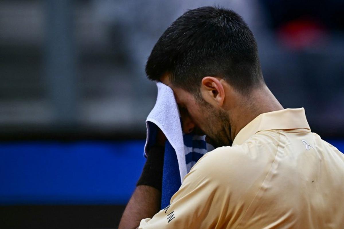 Serbia's Novak Djokovic reacts as he plays against Croatia's Dino Prizmic during their men's singles match of the WTA Rome Open tennis tournament at the Foro Italico in Rome on May 8, 2026.   Filippo MONTEFORTE / AFP