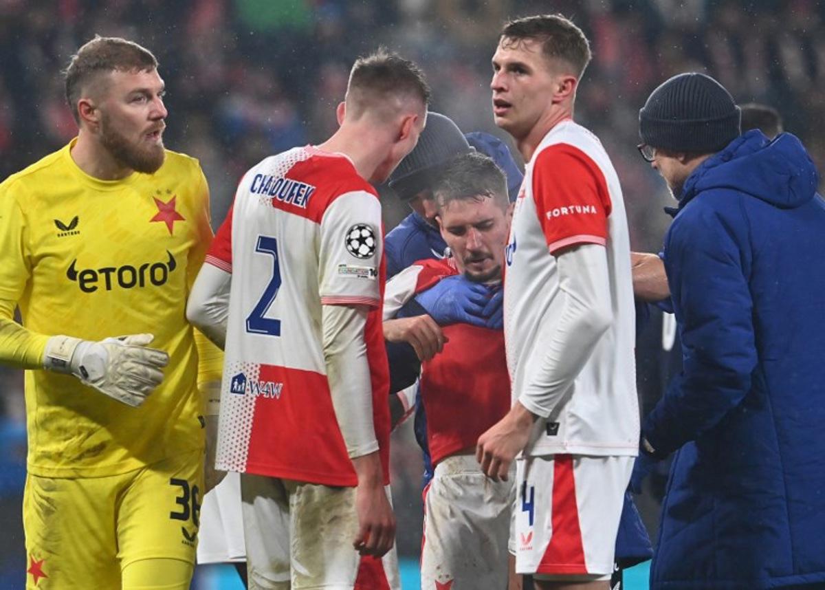 Slavia Prague's Czech midfielder #23 Michal Sadilek is helped during the UEFA Champions League league phase day 5 football match between Slavia Praha and Athletic Bilbao in Prague, on November 25, 2025.  Michal Cizek / AFP