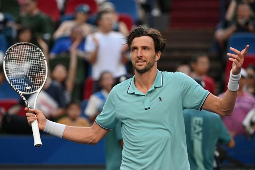 France's Arthur Rinderknech celebrates after winning against Canada's Felix Auger-Aliassime during their quarter-final men's singles match at the Shanghai Masters tennis tournament in Shanghai on October 10, 2025.  Hector RETAMAL / AFP