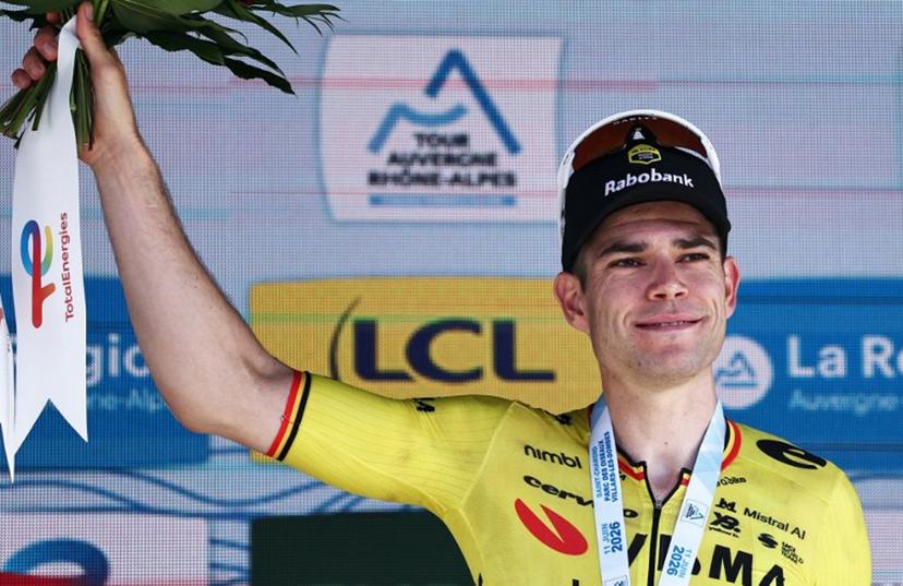 Stage winner Team Visma | Lease a Bike's Belgian rider Wout Van Aert celebrates on the podium of the 5th stage of the Tour Auvergne-Rhone-Alpes cycling race (formerly known as the Criterium du Dauphine), 195,8km between Saint-Chamond and Villars-les-Dombes, central France, on June 11, 2026.  Anne-Christine POUJOULAT / AFP