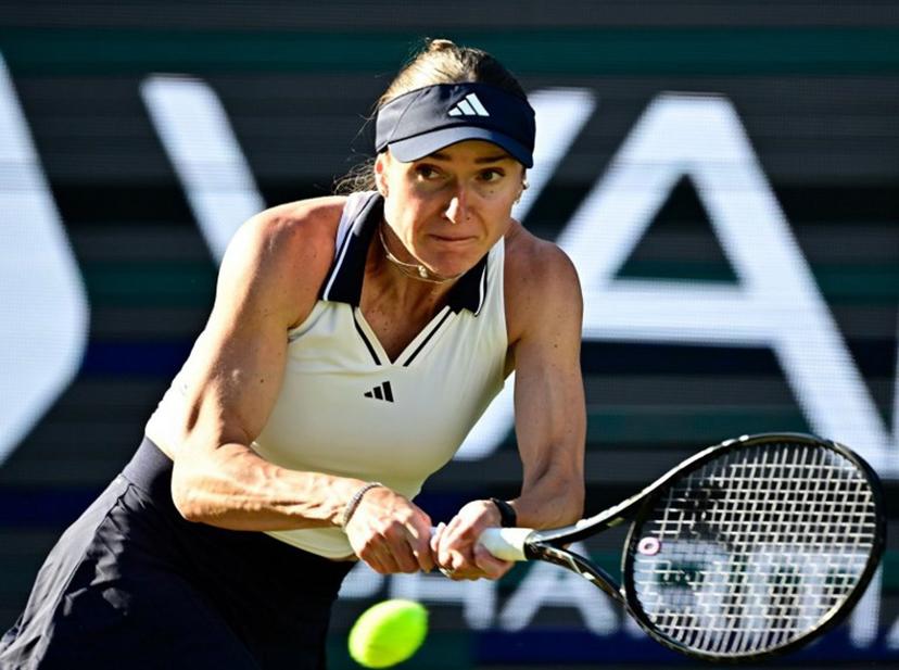 Ukraine's Elina Svitolina returns the ball to the Philippines' Alexandra Eala during the women's singles quarter-final match at the WTA500 Berlin Tennis Open tournament in Berlin on June 19, 2026.  Tobias SCHWARZ / AFP