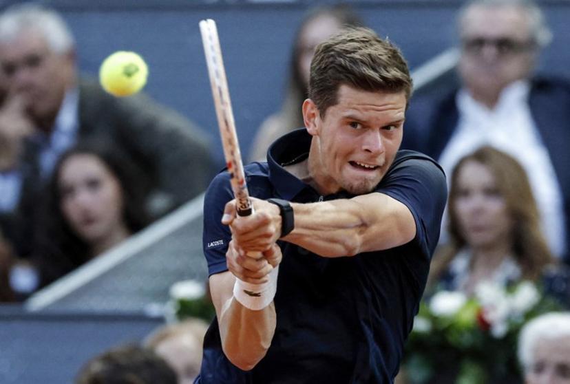 Belgium's Alexander Blockx returns the ball to Germany's Alexander Zverev during their 2026 ATP Tour Madrid Open tennis tournament semi-final singles match at the Caja Magica in Madrid, on May 1, 2026.  OSCAR DEL POZO / AFP