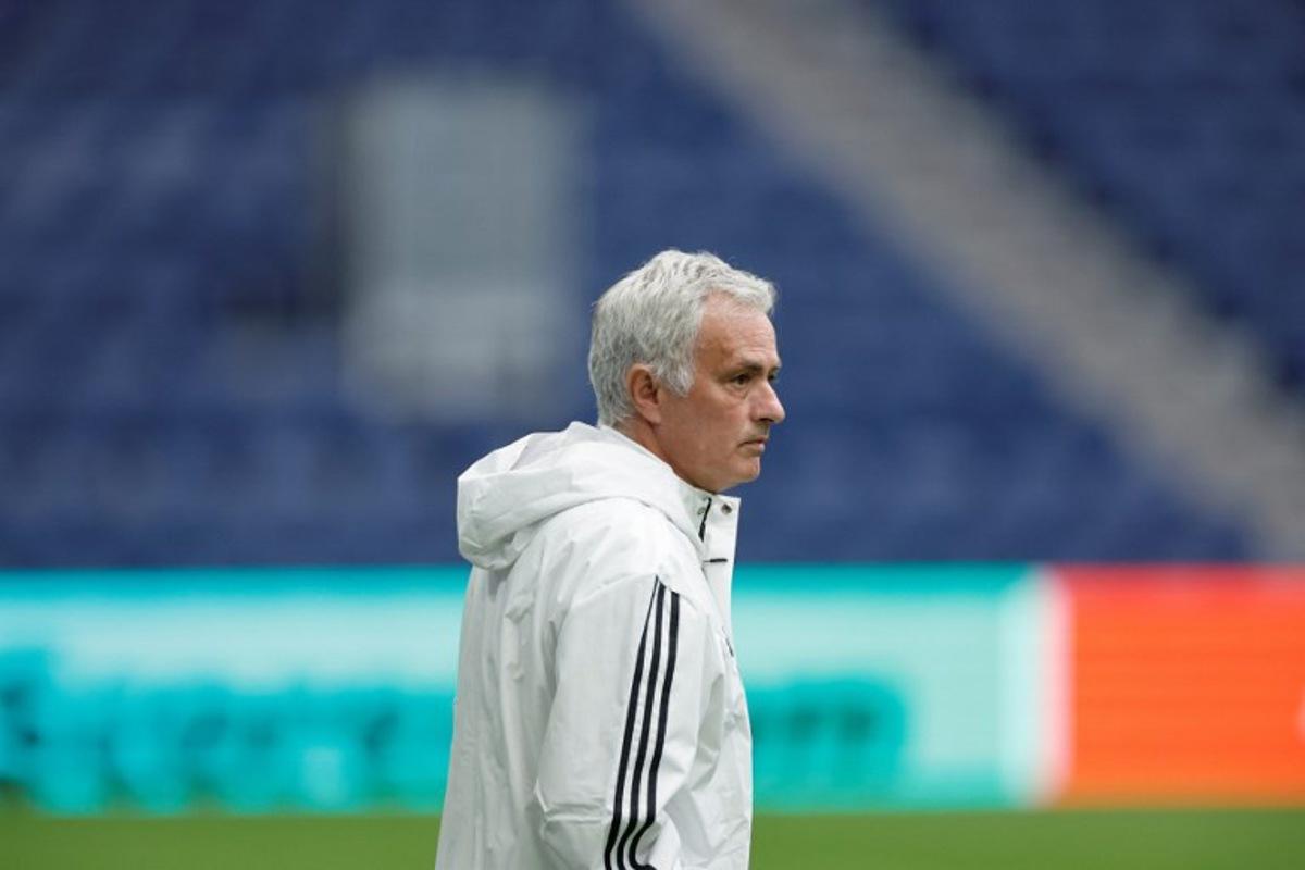 SL Benfica's Portuguese head coach Jose Mourinho looks on during a training on the eve of their UEFA Champions League knockout round play-off second leg football match against Real Madrid CF at Santiago Bernabeu Stadium in Madrid on February 24, 2026.  Oscar DEL POZO / AFP