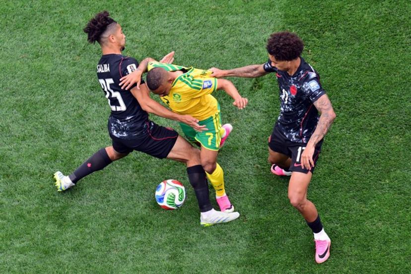 Canada's midfielder #25 Nathan Saliba, South Africa's forward #17 Evidence Makgopa, and Canada's midfielder #07 Stephen Eustaquio fight for the ball during the 2026 World Cup round of 32 football match between South Africa and Canada at the Los Angeles Stadium in Inglewood on June 28, 2026.   Frederic J. Brown / AFP