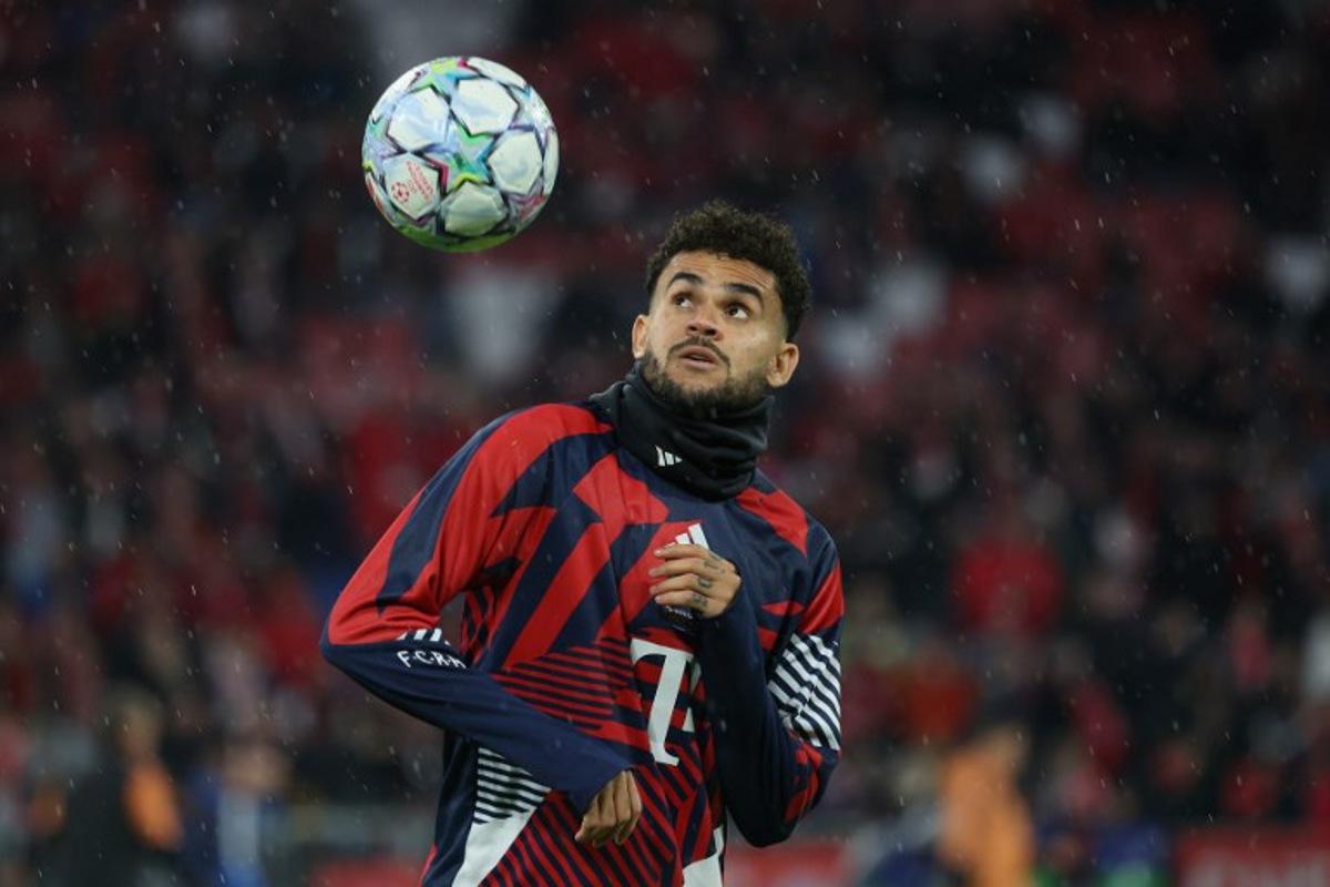 Bayern Munich's Colombian forward #14 Luis Diaz warms up prior to the UEFA Champions League football match between FC Bayern Munich and Arsenal FC in Munich, southern Germany on October 21, 2026.  Karl-Josef HILDENBRAND / AFP