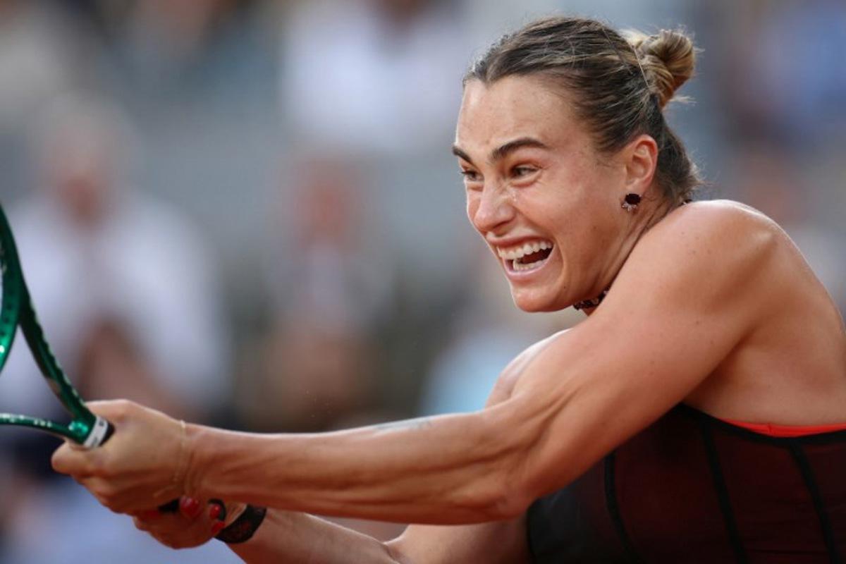 Aryna Sabalenka plays a backhand return to Japan's Naomi Osaka during their women's singles match on day 9 of the French Open tennis tournament on Court Philippe-Chatrier at the Roland-Garros Complex in Paris on June 1, 2026.  ALAIN JOCARD / AFP