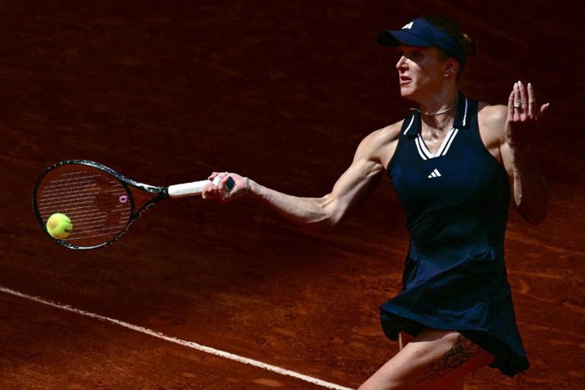 Ukraine's Elina Svitolina plays a forehand return to Germany's Tamara Korpatsch during their women's singles match on day 6 of the French Open tennis tournament on Court Suzanne-Lenglen at the Roland-Garros Complex in Paris on May 29, 2026.  JULIEN DE ROSA / AFP