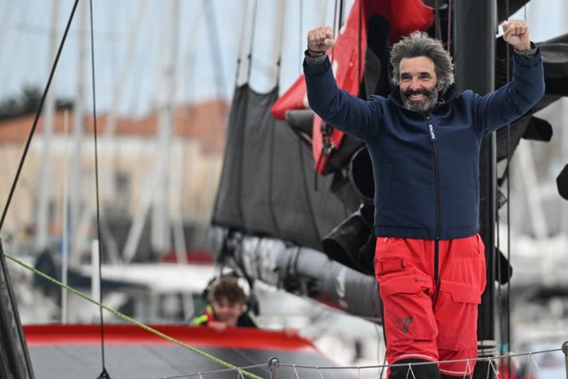 Belgian skipper Denis Van Weynbergh celebrates from his Imoca monohull D Ieteren Group upon his arrival at Les Sables-d'Olonne at the end of the 10th edition of the Vendee Globe around the world monohull solo sailing race in Les Sables-d'Olonne, western France, on March 8, 2025.   Sebastien Salom-Gomis / AFP