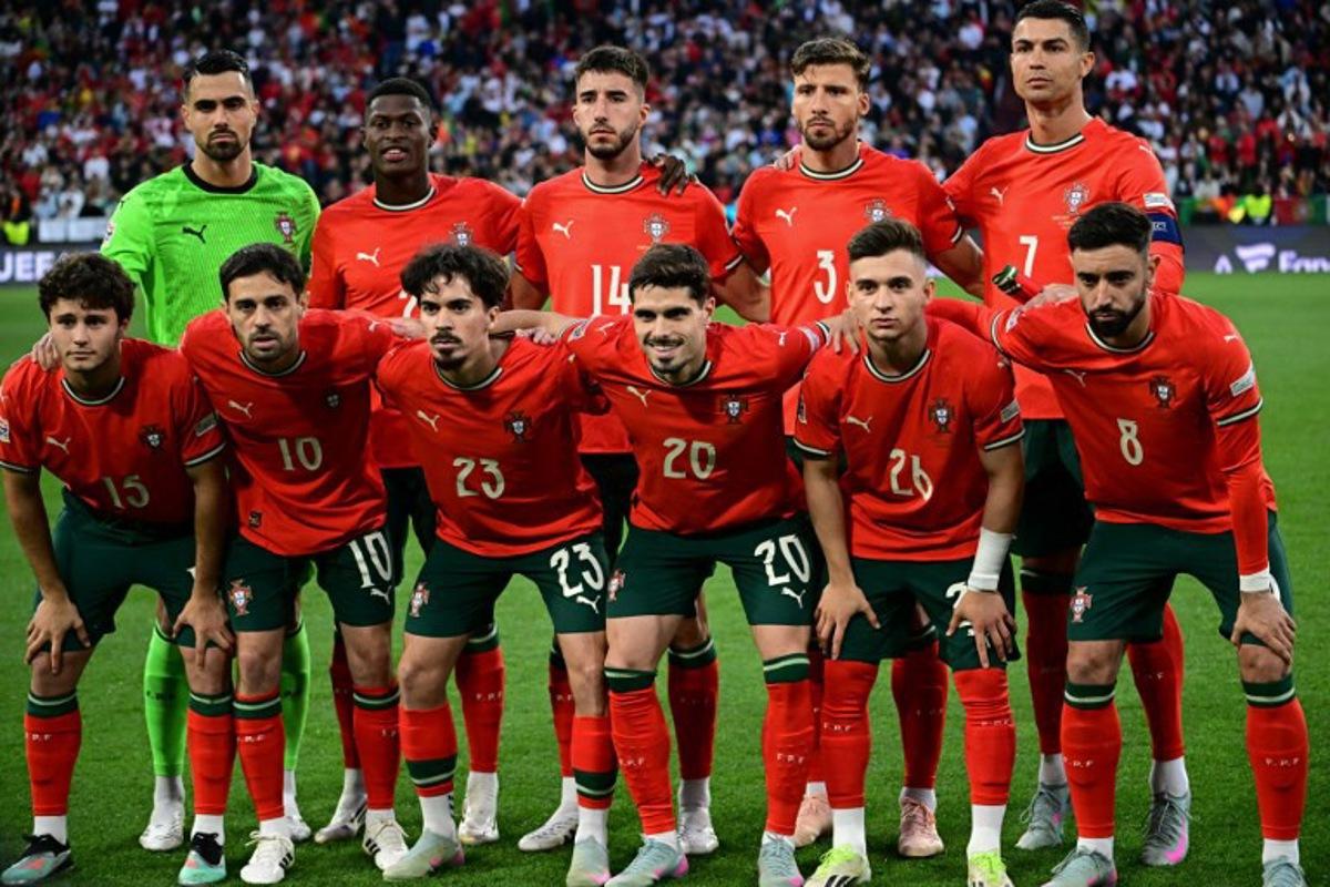Portugal players pose for the team photo prior to the UEFA Nations League final football match between Portugal and Spain in Munich, southern Germany on June 8, 2025.  Tobias SCHWARZ / AFP