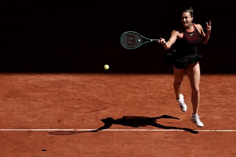 Belarus' Aryna Sabalenka plays a forehand return to Spain's Jessica Bouzas Maneiro during their women's singles match on day 3 of the French Open tennis tournament on Court Philippe-Chatrier at the Roland-Garros Complex in Paris on May 26, 2026.  Anne-Christine POUJOULAT / AFP