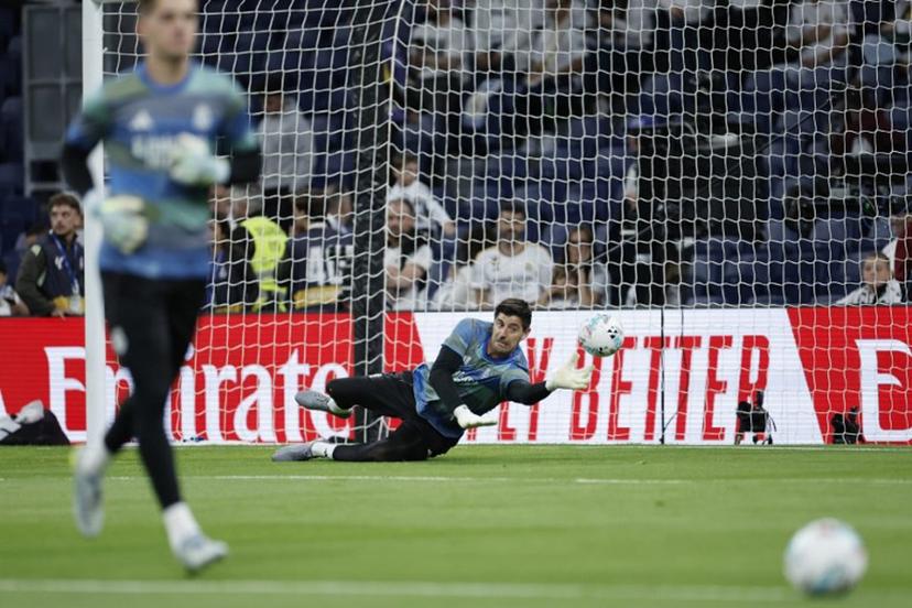 Real Madrid's Belgian goalkeeper #01 Thibaut Courtois warms up before the Spanish league football match between Real Madrid CF and Real Oviedo at Santiago Bernabeu Stadium in Madrid on May 14, 2026.  Oscar DEL POZO / AFP