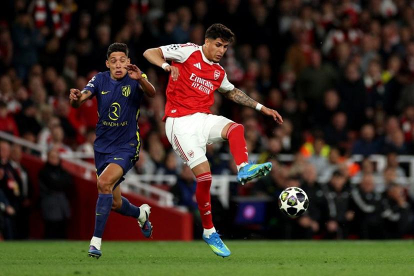 Arsenal's Ecuadorian defender #05 Piero Hincapie passes the ball during the UEFA Champions League second-leg semi-final football match between Arsenal and Atletico Madrid at the Emirates Stadium in north London on May 5, 2026.  Adrian Dennis / AFP