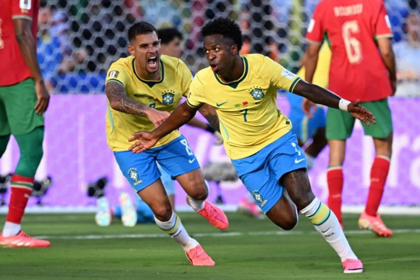 Brazil's forward #07 Vinicius Junior (R) celebrates scoring his team's first goal during the 2026 World Cup Group C football match between Brazil and Morocco at the New York/New Jersey Stadium in East Rutherford on June 13, 2026.  Jewel SAMAD / AFP