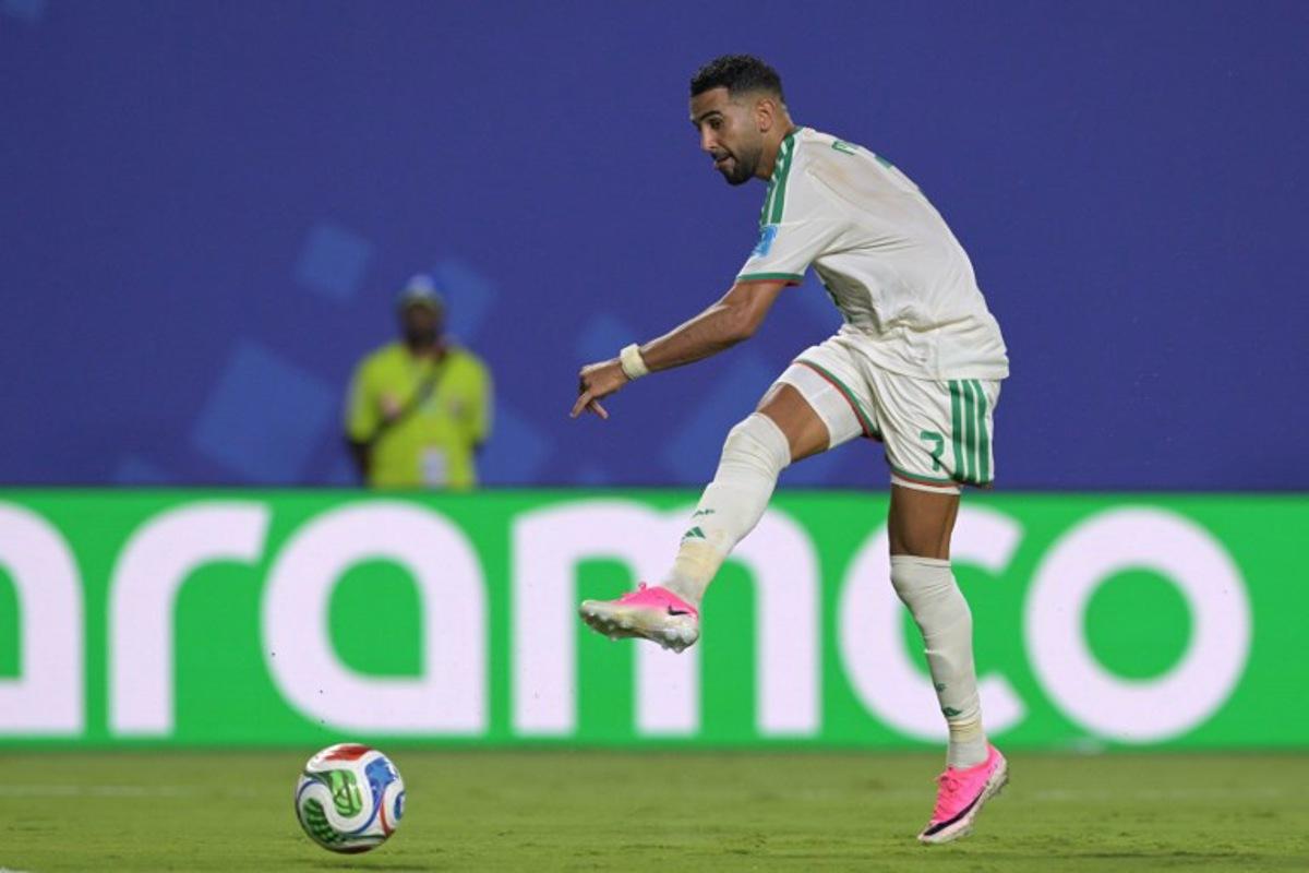 Algeria's forward #7 Riyad Mahrez kicks to score his team's third goal during the 2026 World Cup Group J football match between Algeria and Austria at the Kansas City Stadium in Kansas City on June 27, 2026.   JUAN MABROMATA / AFP