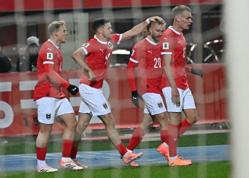 Austria's midfielder #20 Konrad Laimer (2R) celebrates with teammates scoring his team's first goal that was disallowed after during the FIFA World Cup 2026 European qualification Group H football match between Austria and Bosnia and Herzegovina, in Vienna on November 18, 2025.  Joe Klamar / AFP