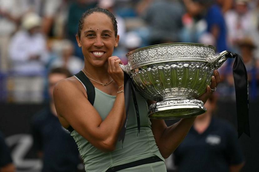 US player Madison Keys poses with the trophy after her win over Germany's Tatjana Maria during their women's final tennis match on day six of the Lexus Eastbourne Open at Devonshire Park, Eastbourne, on the south coast of England on June 27, 2026.  Glyn KIRK / AFP