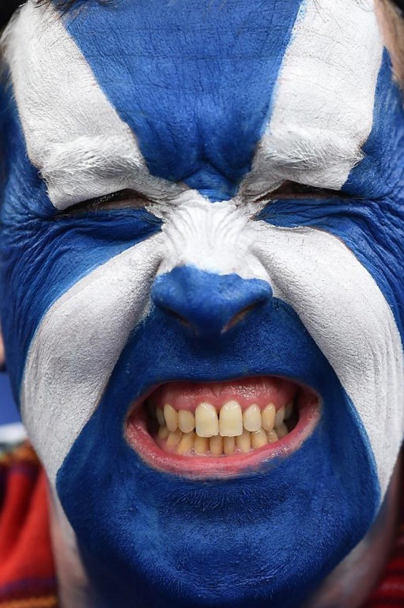 A member of the Tartan Army poses for a picture ahead of the friendly international football match between Scotland and Ivory Coast at the Hill Dickinson Stadium in Liverpool, north west England on March 31, 2026.    PETER POWELL / AFP