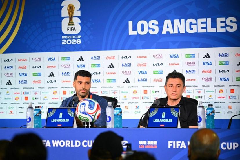 Iran's head coach Amir Ghalenoei (R) gives a press conference next to Iran's forward #09 Mehdi Taremi at Los Angeles Stadium in Inglewood on June 14, 2026, on the eve of the 2026 World Cup football match between Iran and New Zealand.  Patrick T. FALLON / AFP