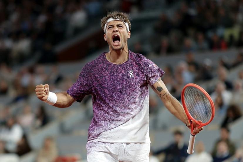 Italy's Flavio Cobolli reacts after a point as he plays against Canada's Felix Auger-Aliassime during their men's quarter final singles match on day 11 of the French Open tennis tournament on Court Philippe-Chatrier at the Roland-Garros Complex in Paris on June 3, 2026.  Thomas SAMSON / AFP